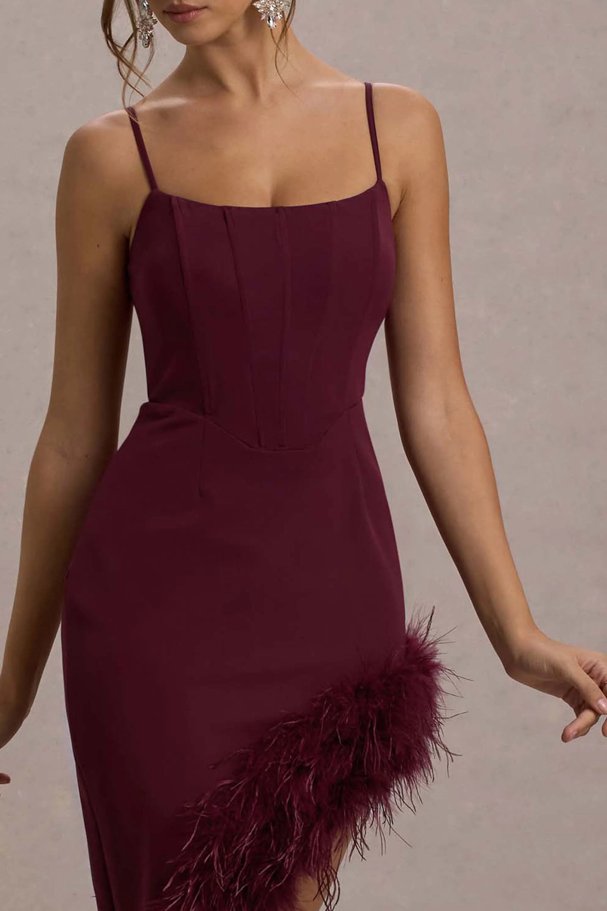 1245-high-status-burgundy-strappy-corset-asymmetric-maxi-dress-with-feather-trim-1.webp