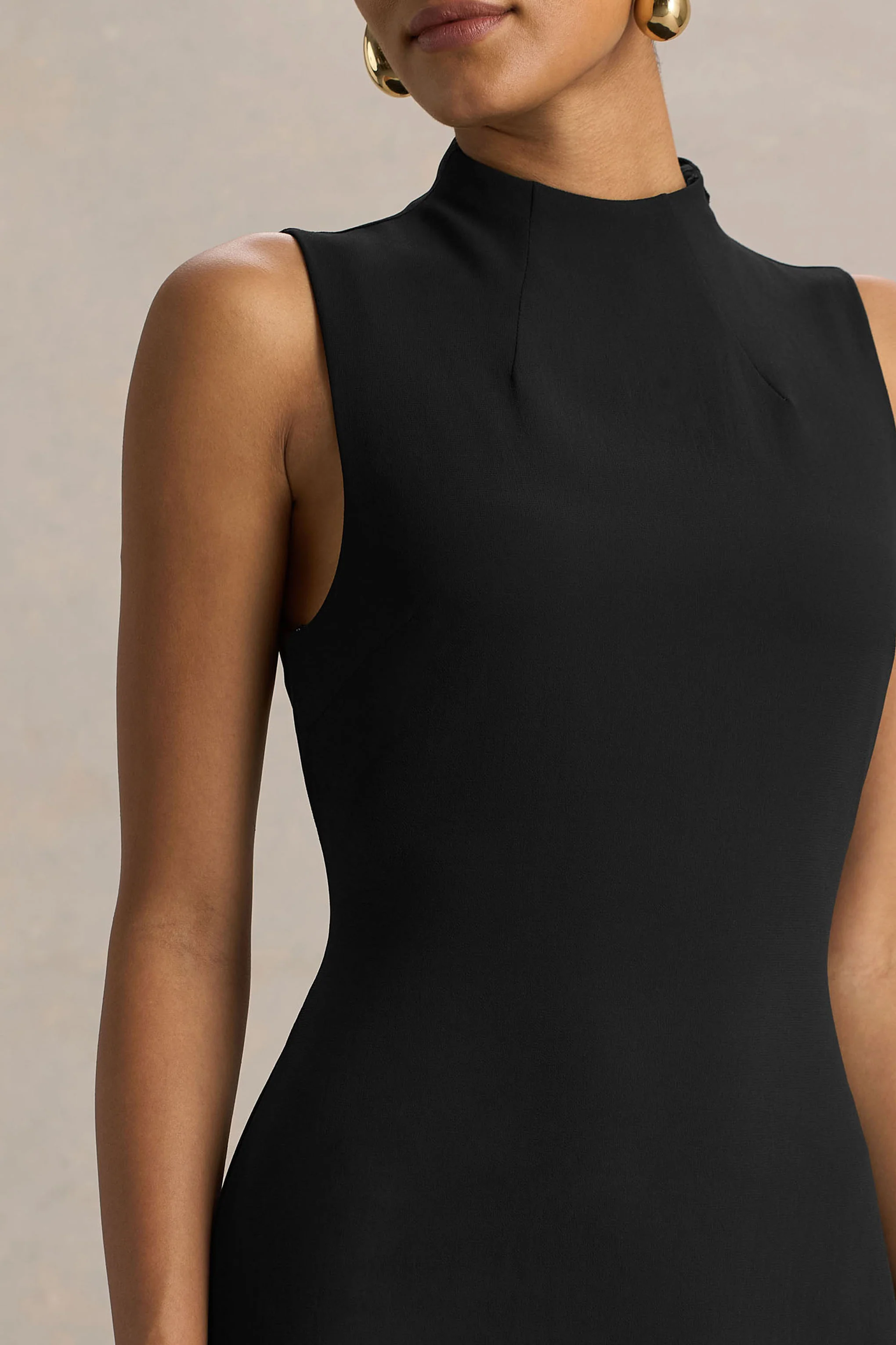 13389-unpredictable-black-high-neck-maxi-dress-with-back-cape-detail-1.webp