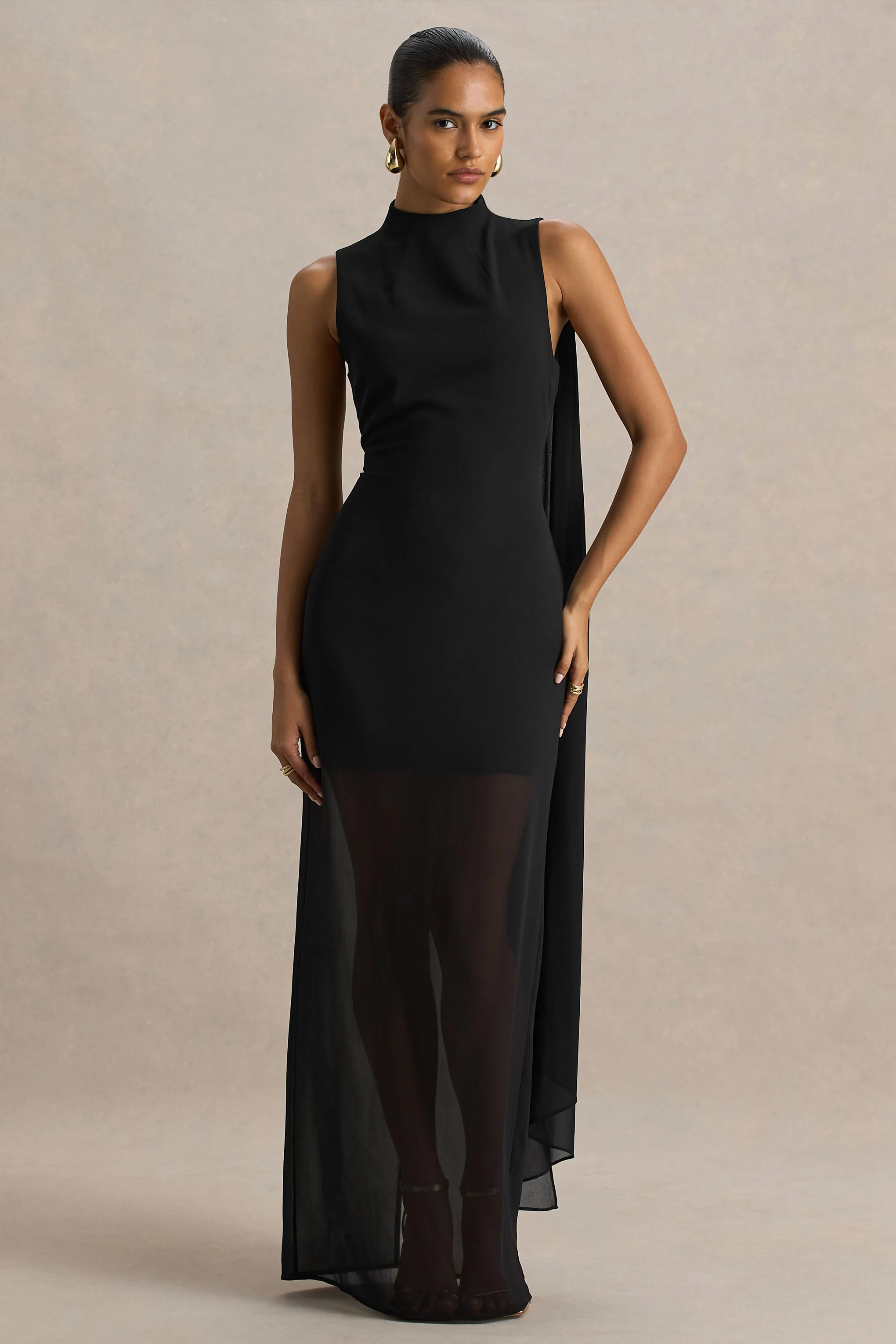 13389-unpredictable-black-high-neck-maxi-dress-with-back-cape-detail-1.webp