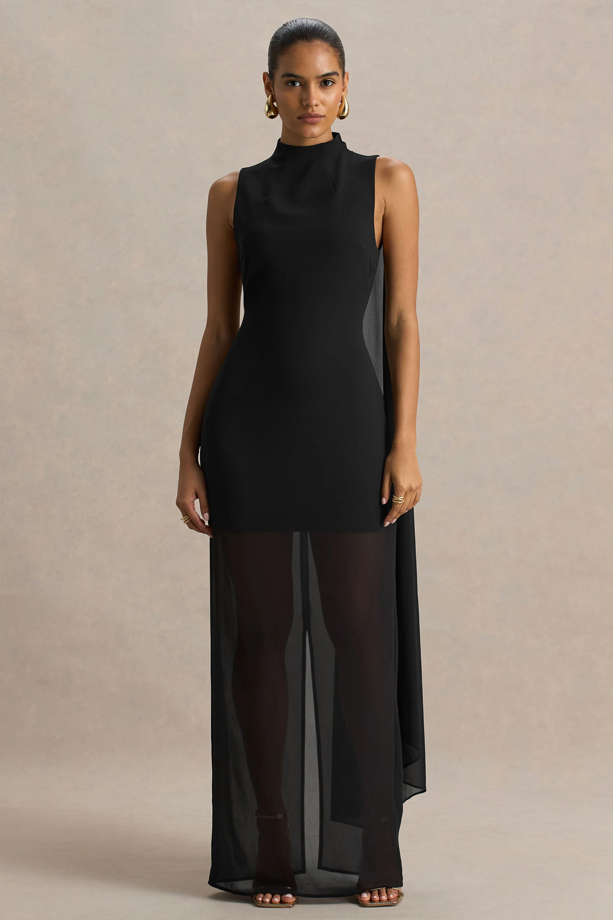 13389-unpredictable-black-high-neck-maxi-dress-with-back-cape-detail-1.webp