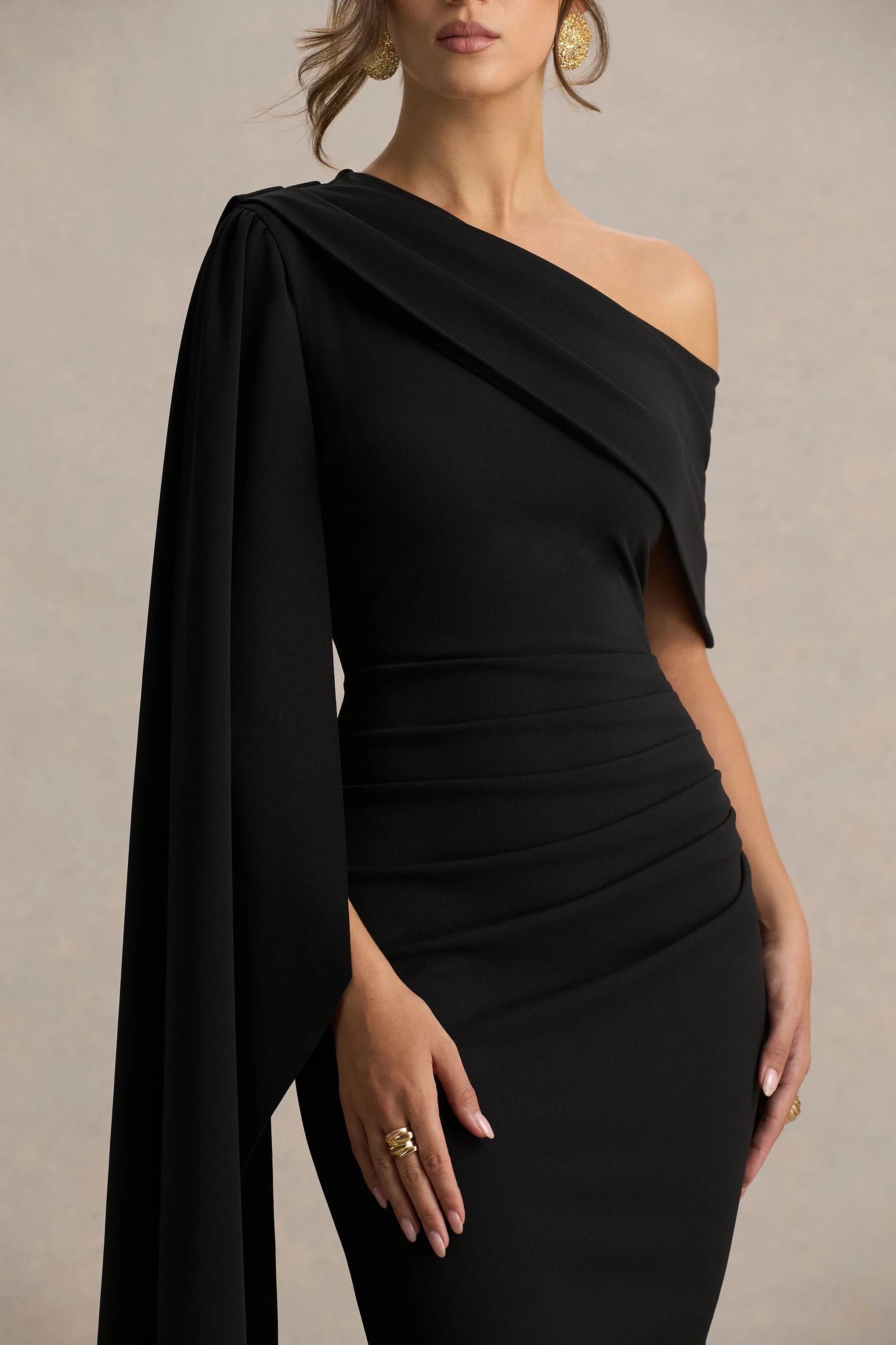 14991-leah-black-asymmetric-neck-midi-dress-with-cape-sleeve-and-draped-detailing-1.webp