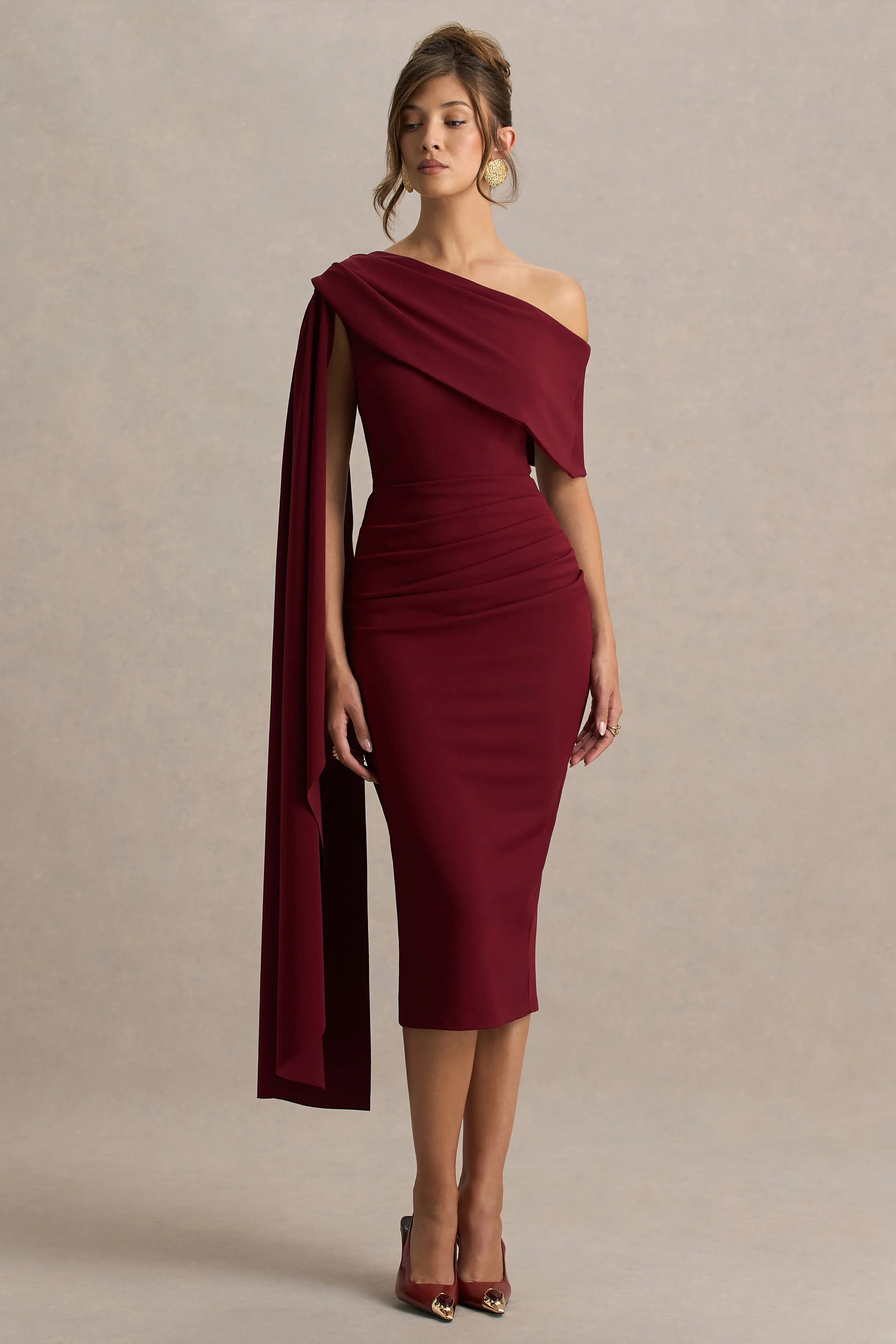 14998-leah-burgundy-asymmetric-neck-midi-dress-with-cape-sleeve-and-draped-detailing-1.webp
