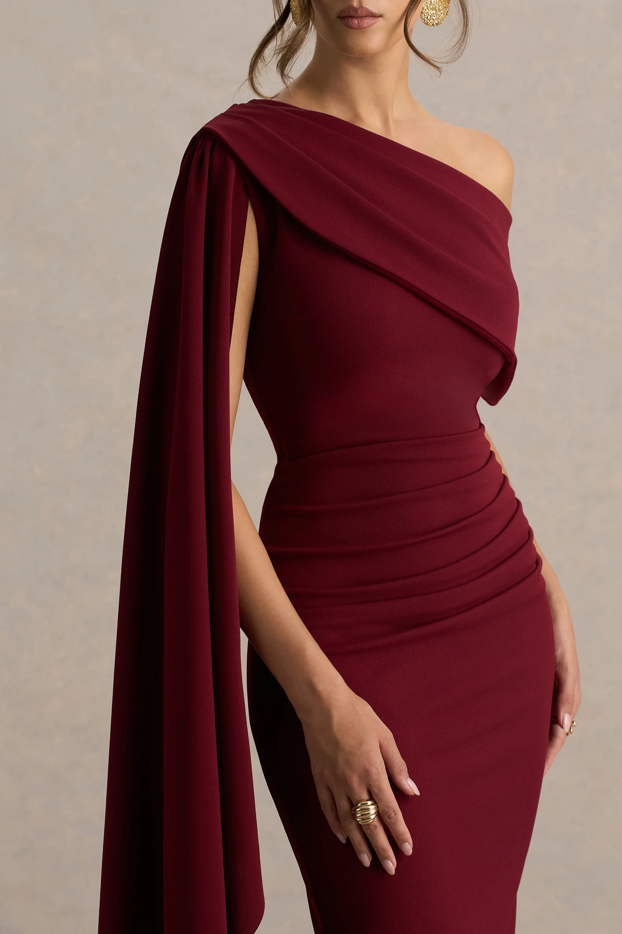 14998-leah-burgundy-asymmetric-neck-midi-dress-with-cape-sleeve-and-draped-detailing-1.webp