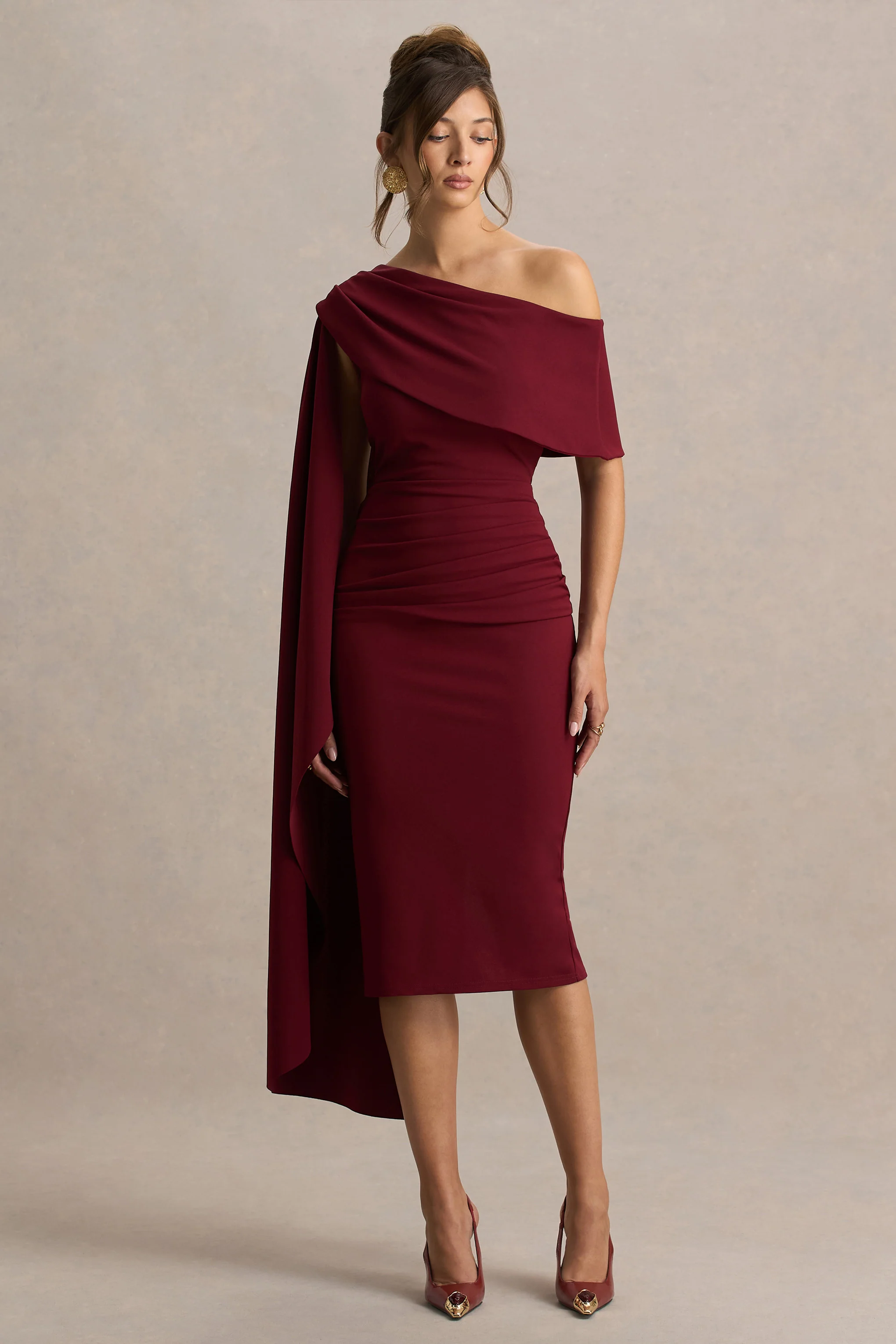 14998-leah-burgundy-asymmetric-neck-midi-dress-with-cape-sleeve-and-draped-detailing-1.webp