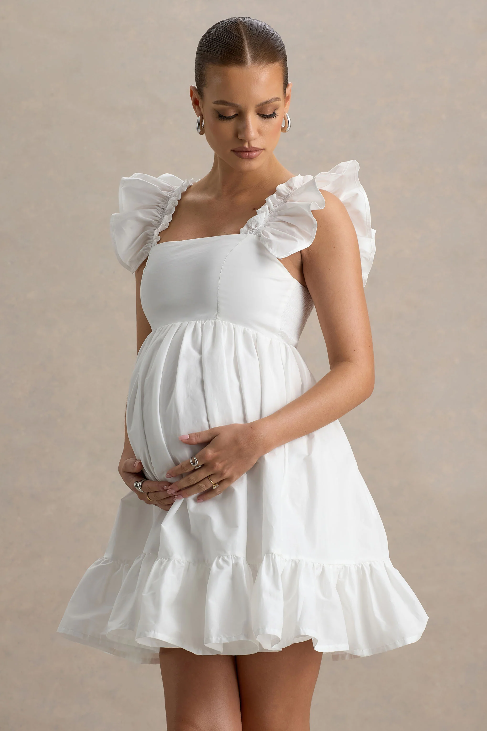 17174-dolly-daze-white-ruffle-sleeve-babydoll-maternity-mini-dress-1.webp