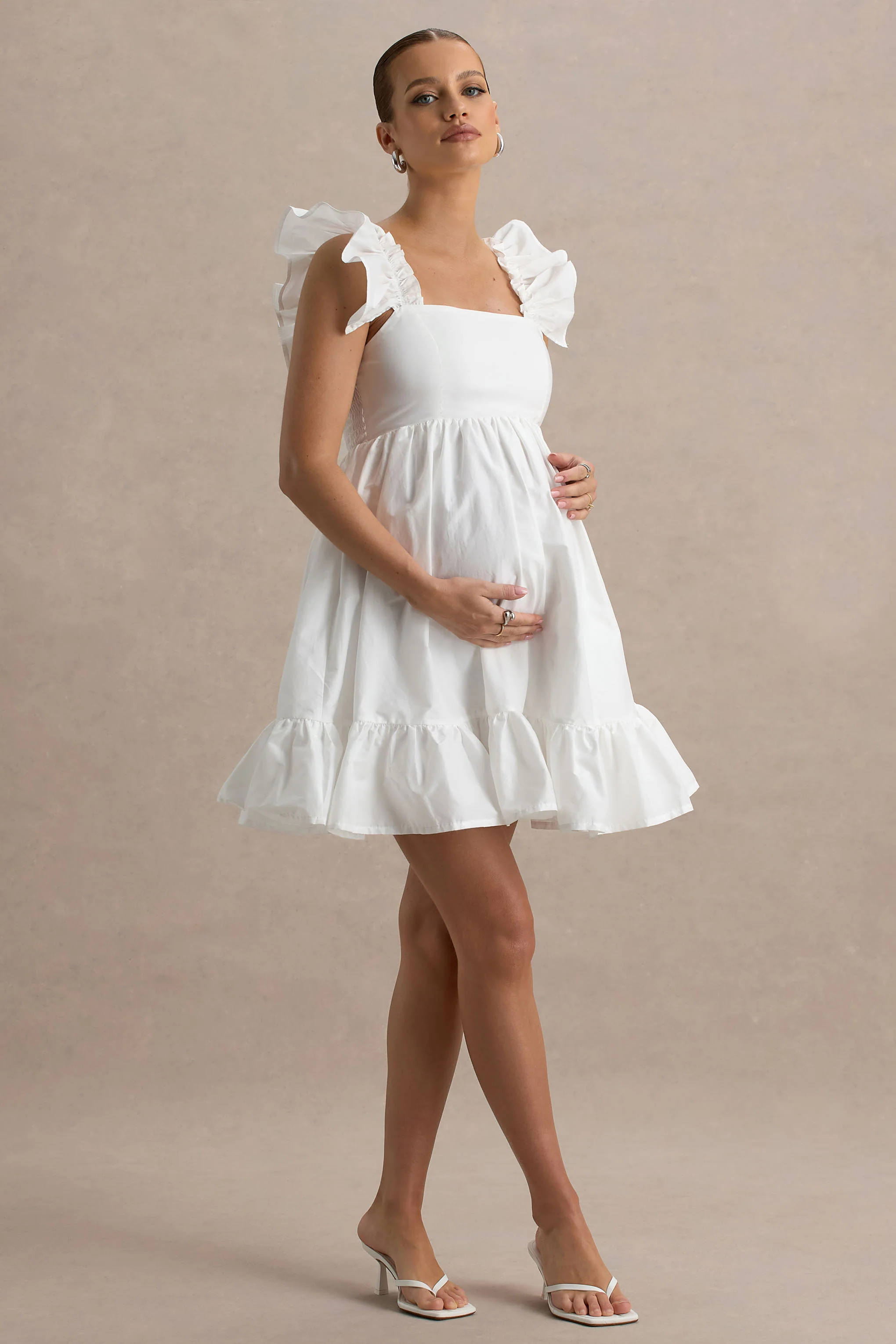 17174-dolly-daze-white-ruffle-sleeve-babydoll-maternity-mini-dress-1.webp