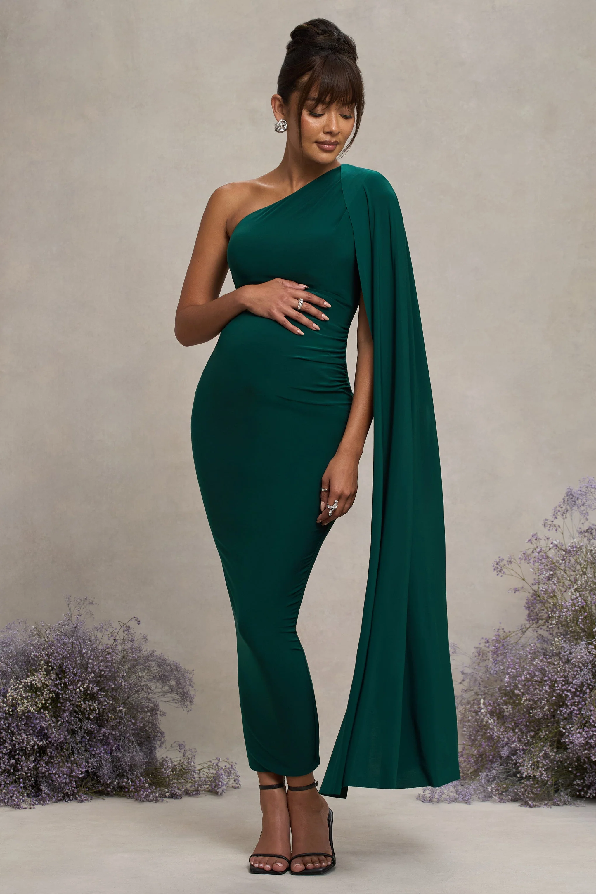 17605-amaryllis-bottle-green-maternity-one-shoulder-maxi-dress-with-cape-sleeve-1.webp
