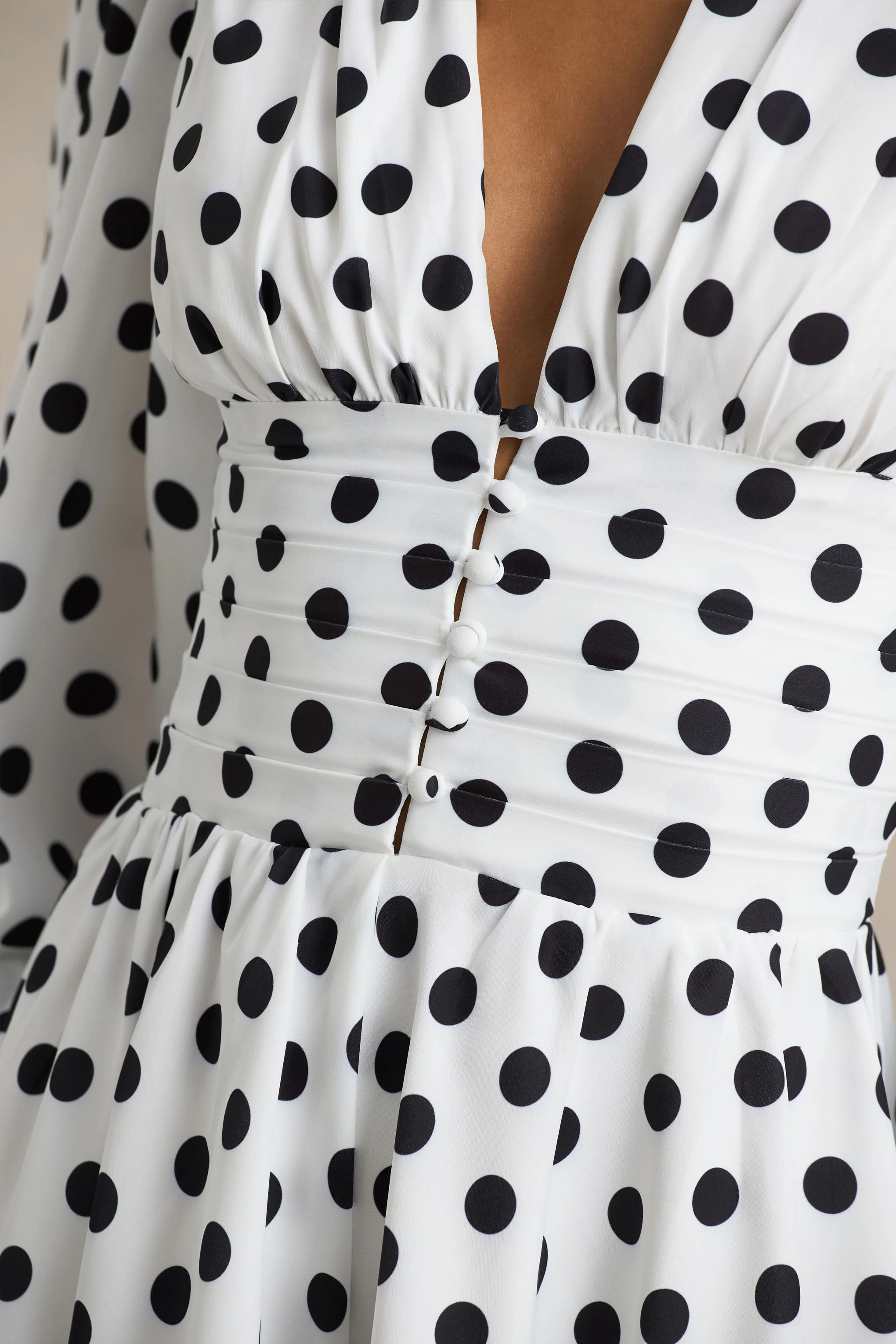 17825-laurel-white-polka-dot-v-neck-balloon-sleeve-playsuit-1.webp