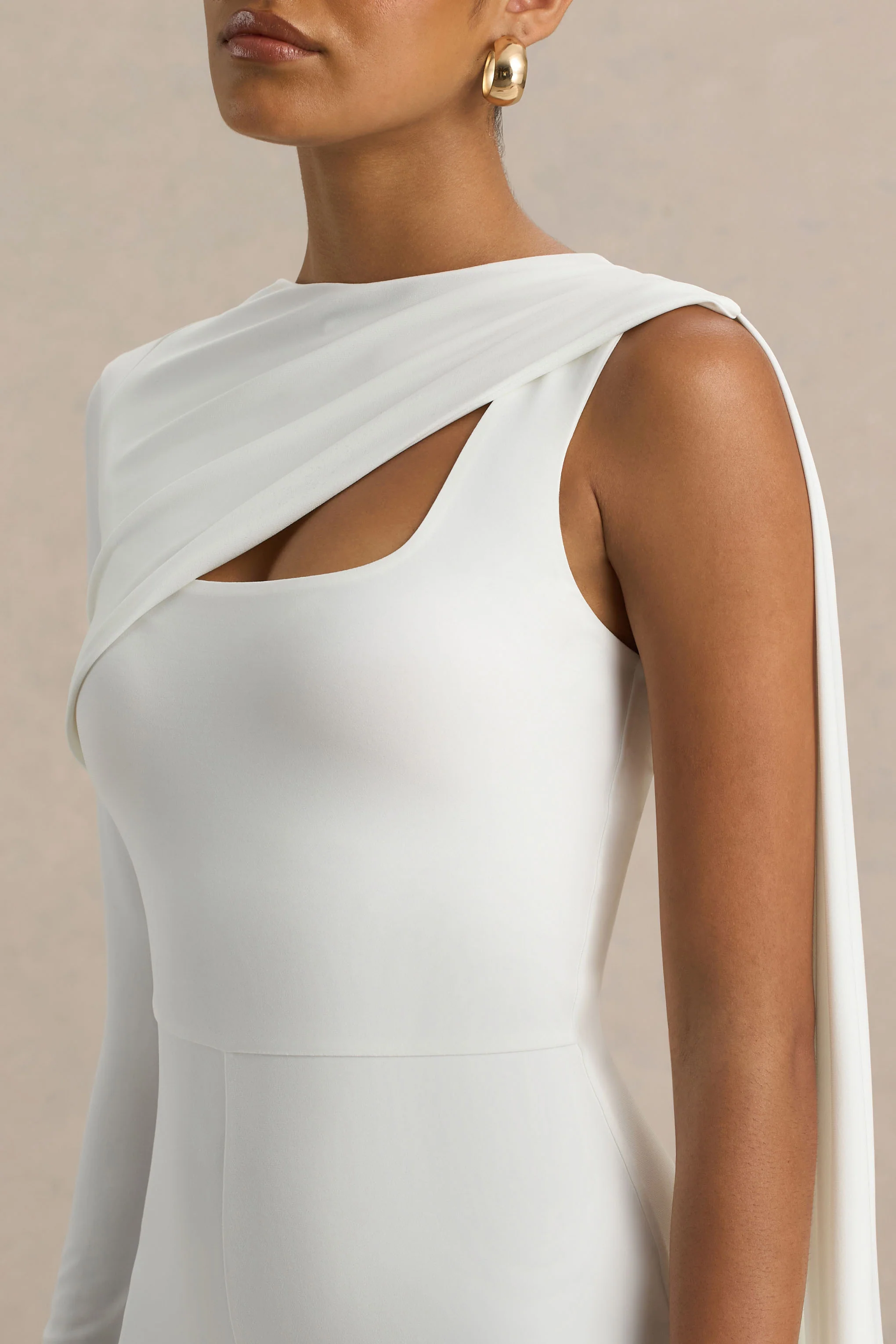 18380-graces-white-high-neck-jumpsuit-with-cape-sleeve-1.webp