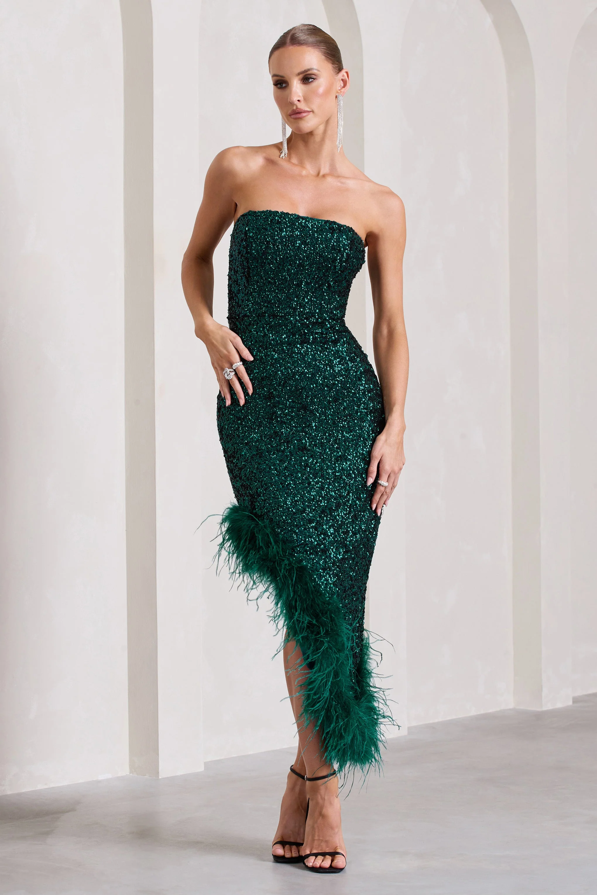 1860-emulate-bottle-green-sequin-asymmetric-bandeau-maxi-dress-with-feathers-1.webp
