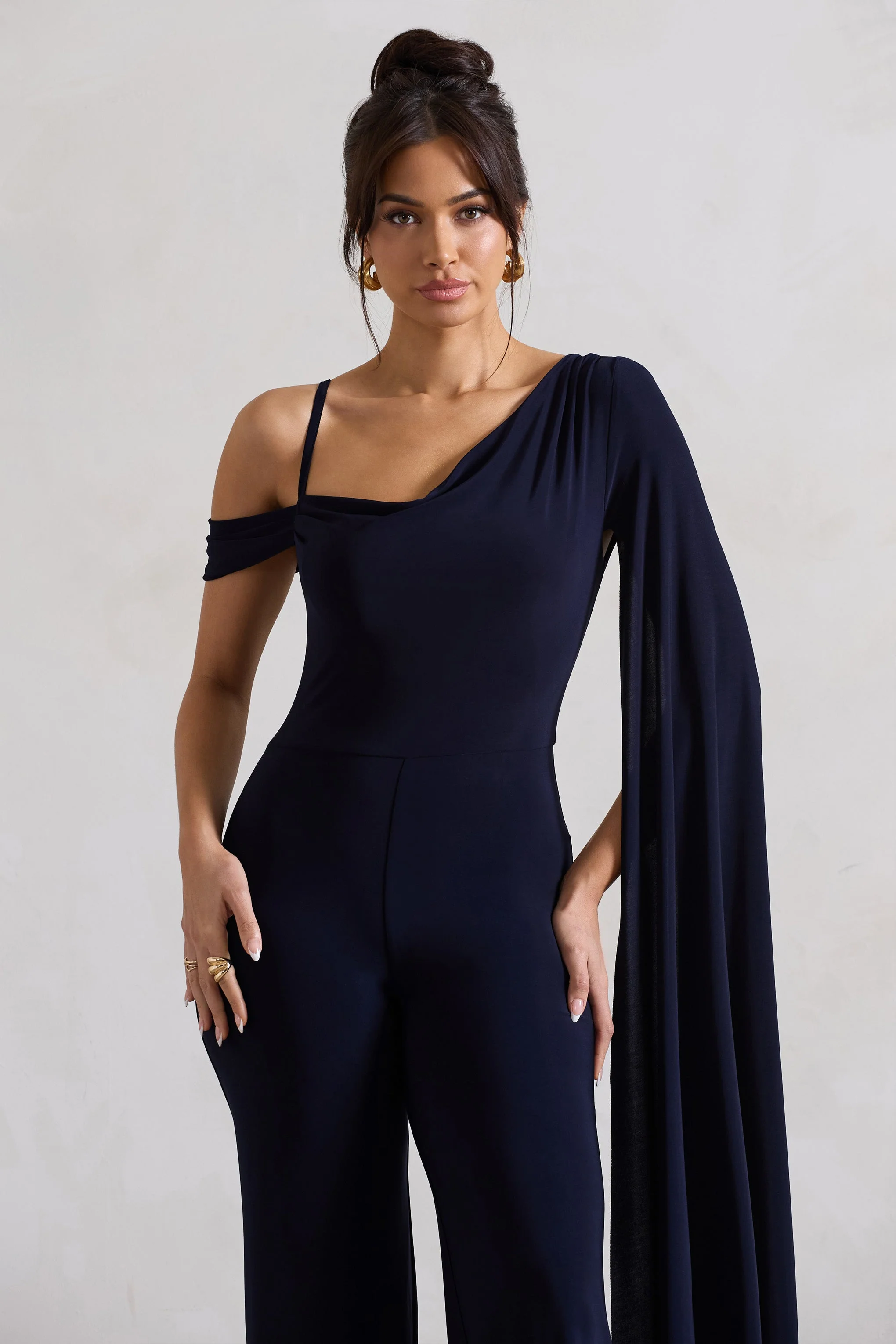 20540-jelena-navy-asymmetric-draped-straight-leg-jumpsuit-with-cape-sleeve-1.webp
