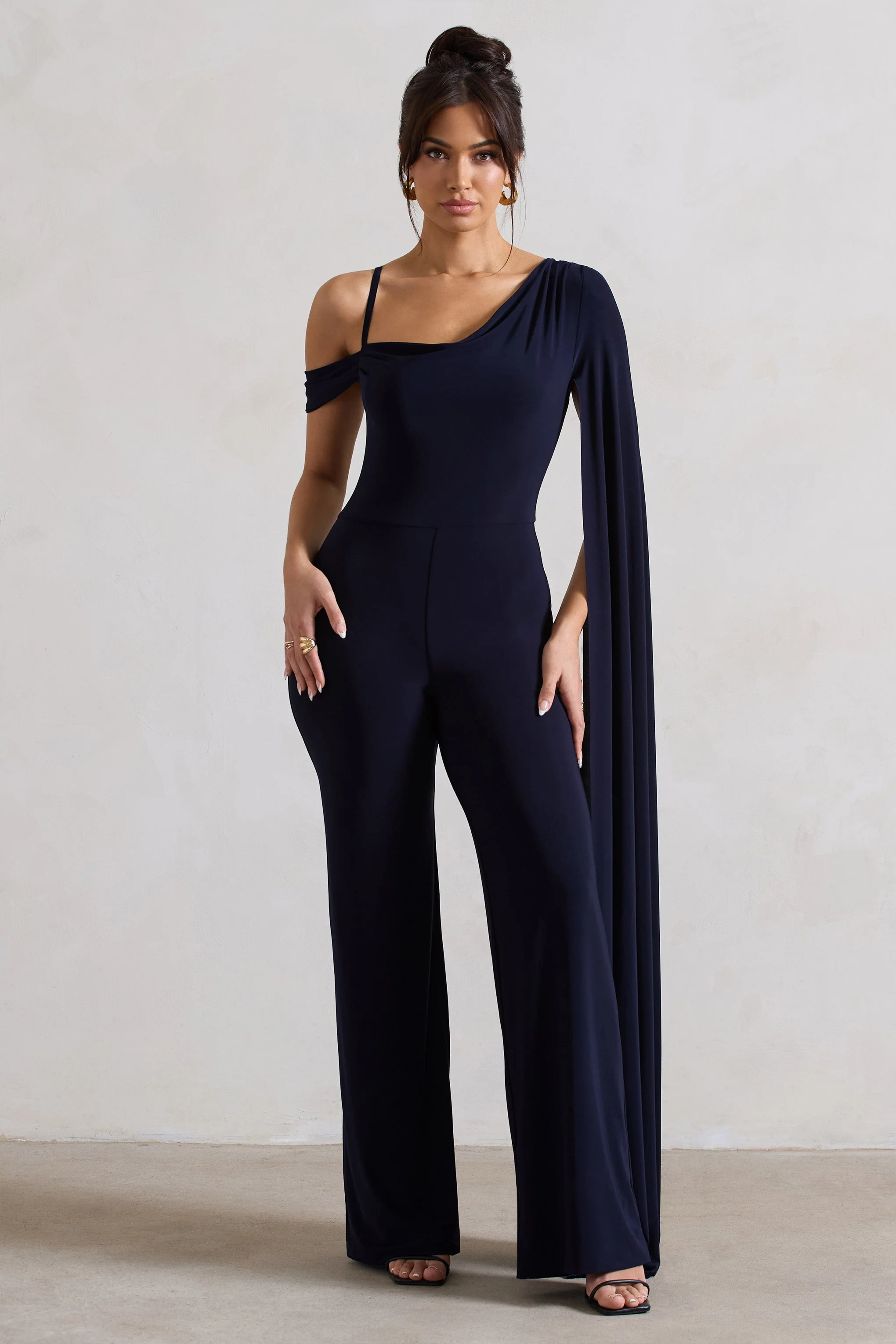 20540-jelena-navy-asymmetric-draped-straight-leg-jumpsuit-with-cape-sleeve-1.webp