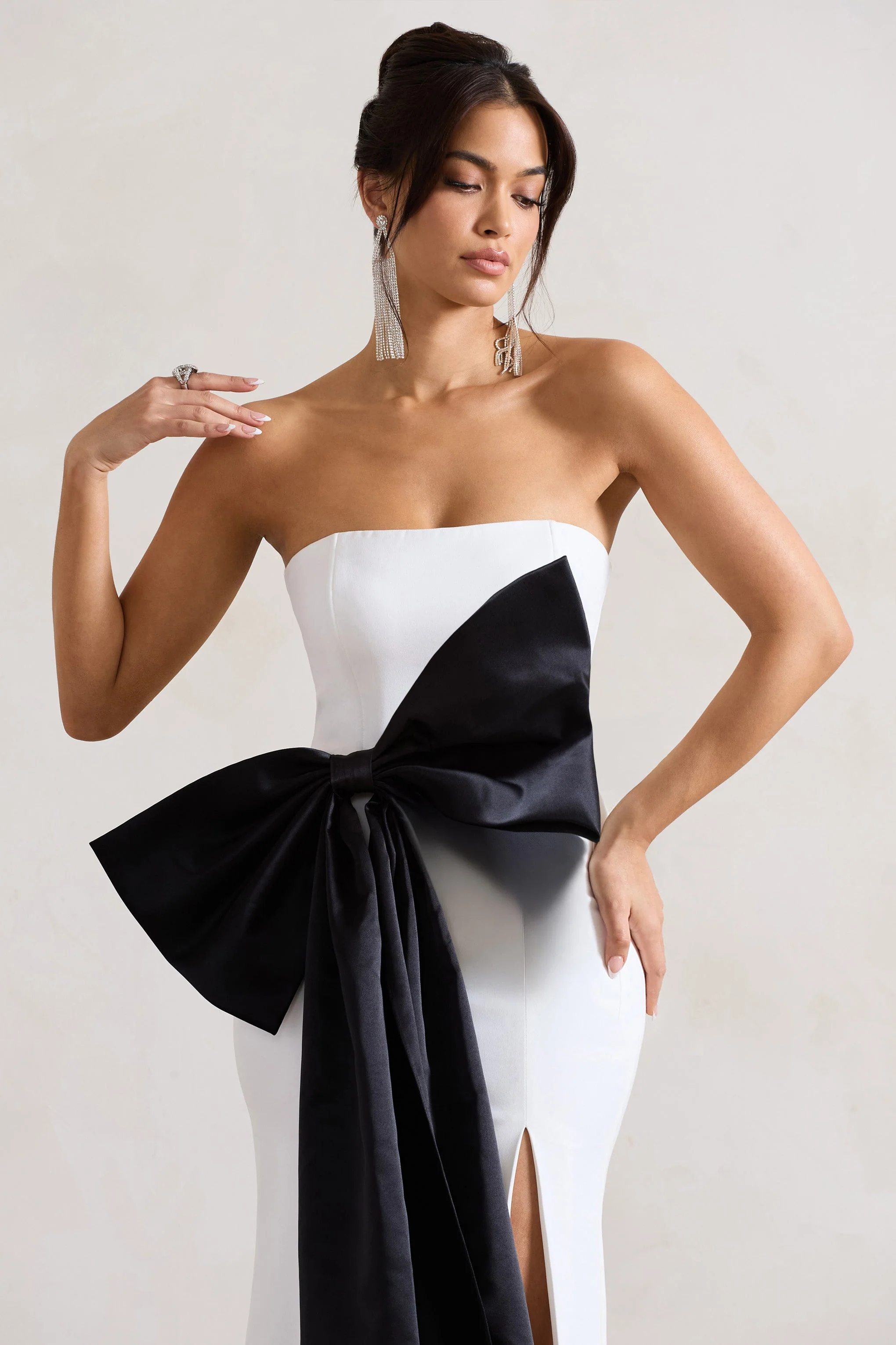 2230-sincerely-white-bandeau-split-maxi-dress-with-oversized-black-bow-1.webp