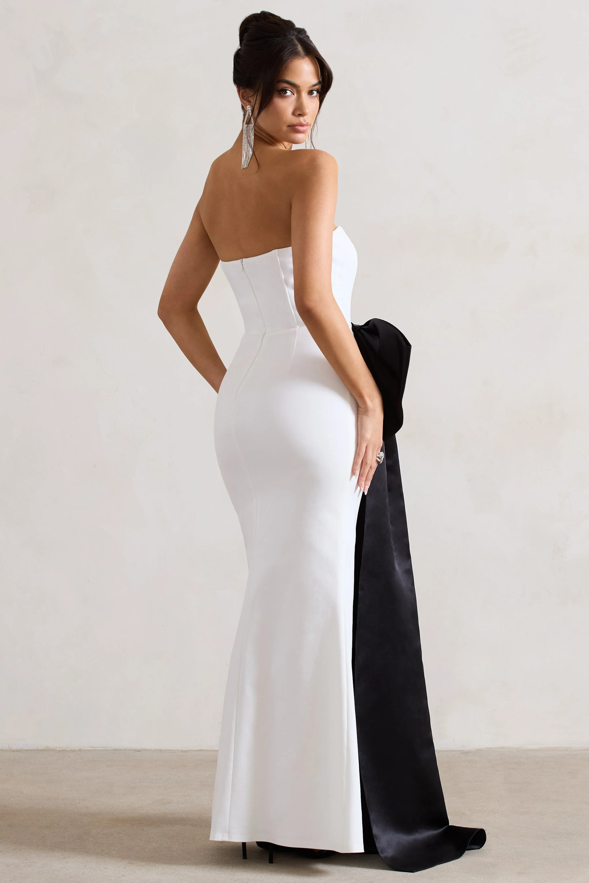 2230-sincerely-white-bandeau-split-maxi-dress-with-oversized-black-bow-1.webp