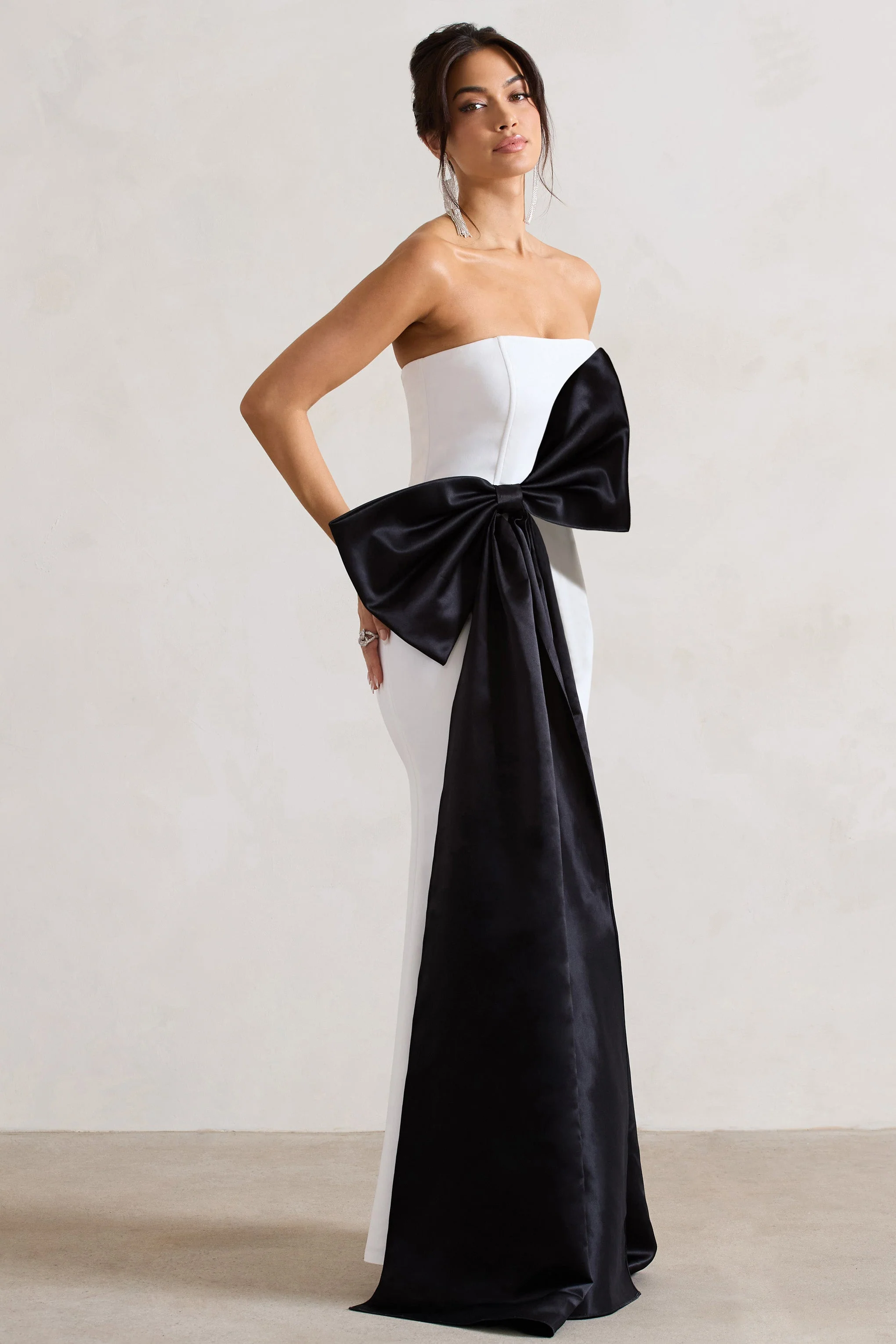 2230-sincerely-white-bandeau-split-maxi-dress-with-oversized-black-bow-1.webp