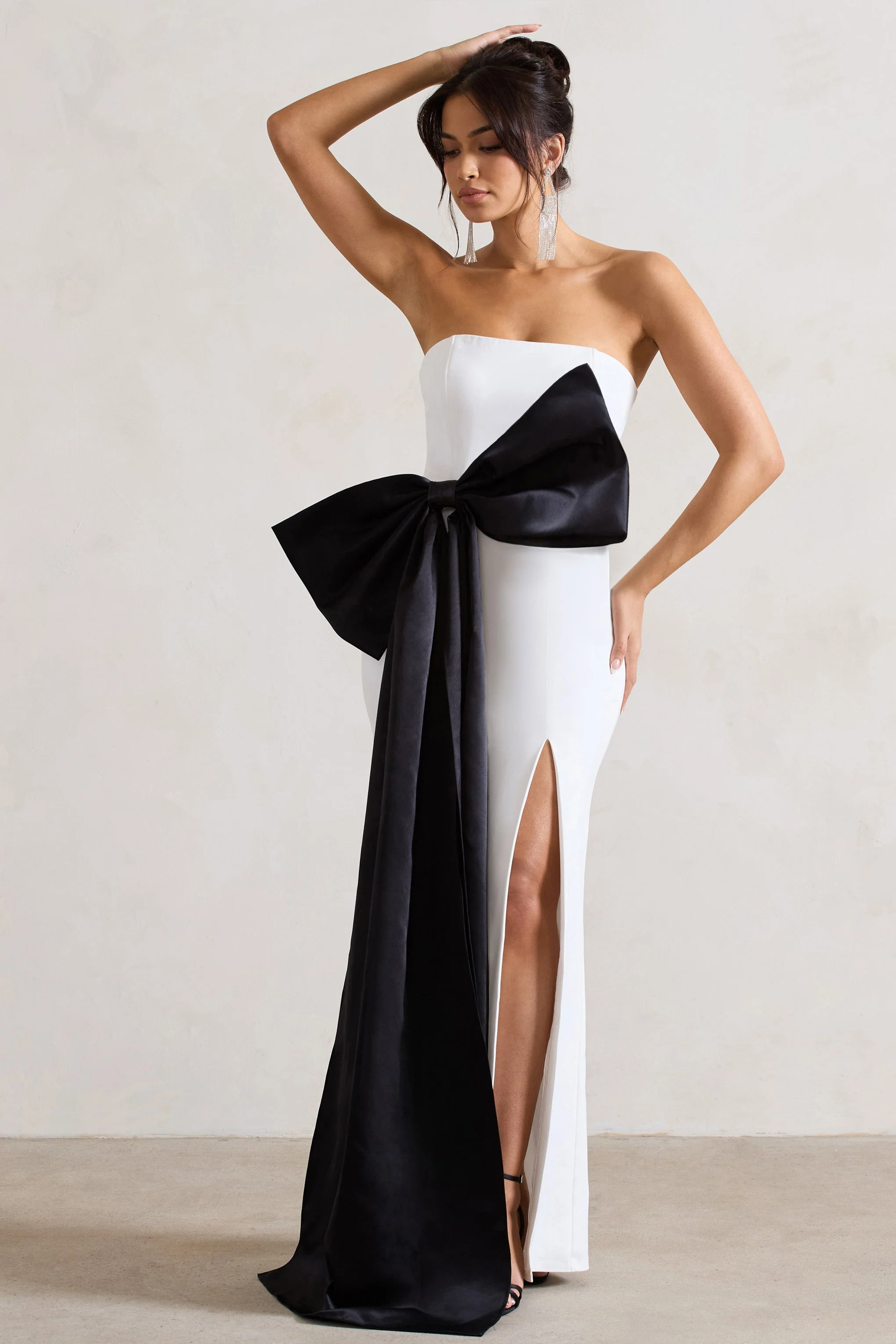 2230-sincerely-white-bandeau-split-maxi-dress-with-oversized-black-bow-1.webp