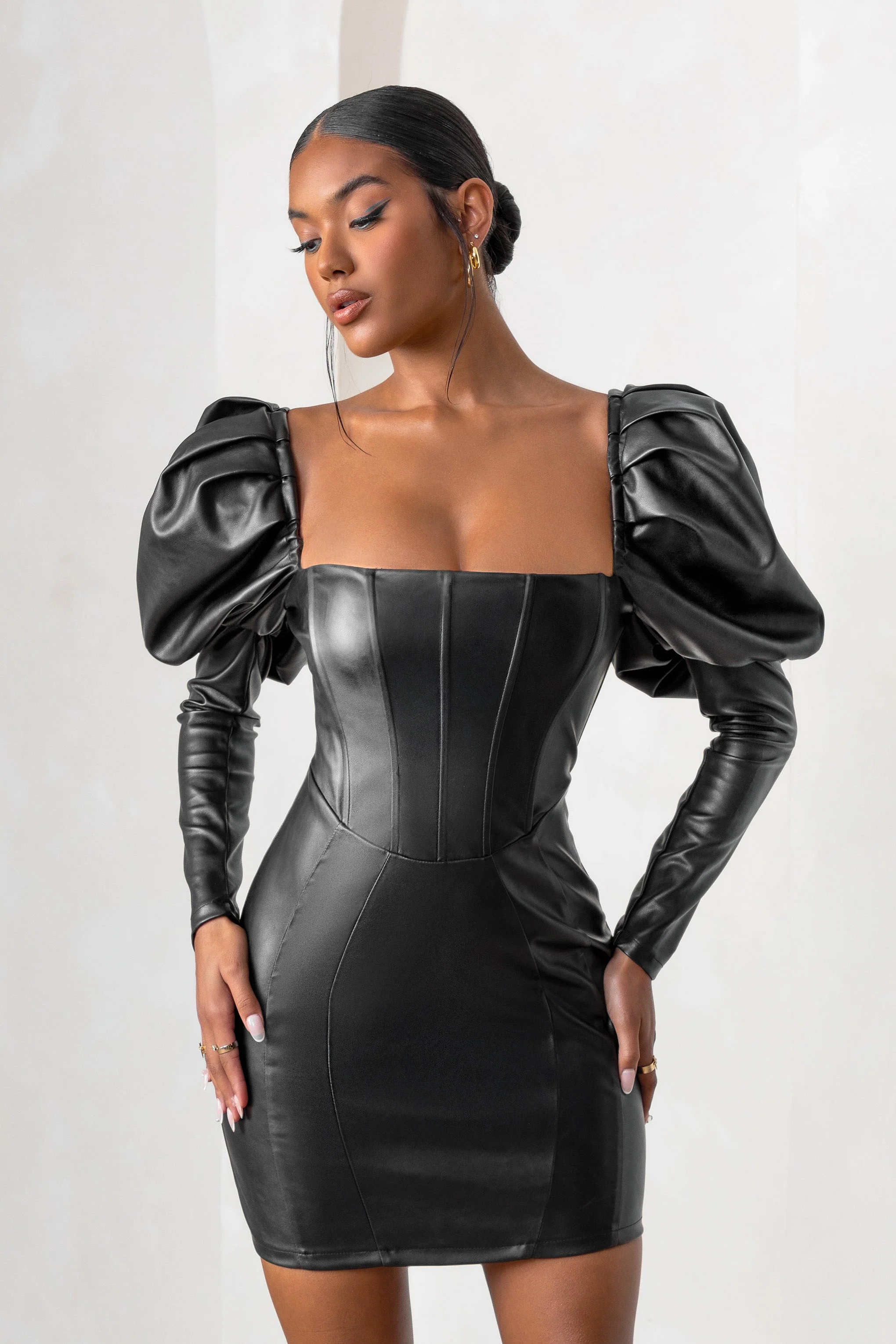 3355-karyme-black-faux-leather-puff-sleeve-mini-dress-with-corset-detail-1.webp