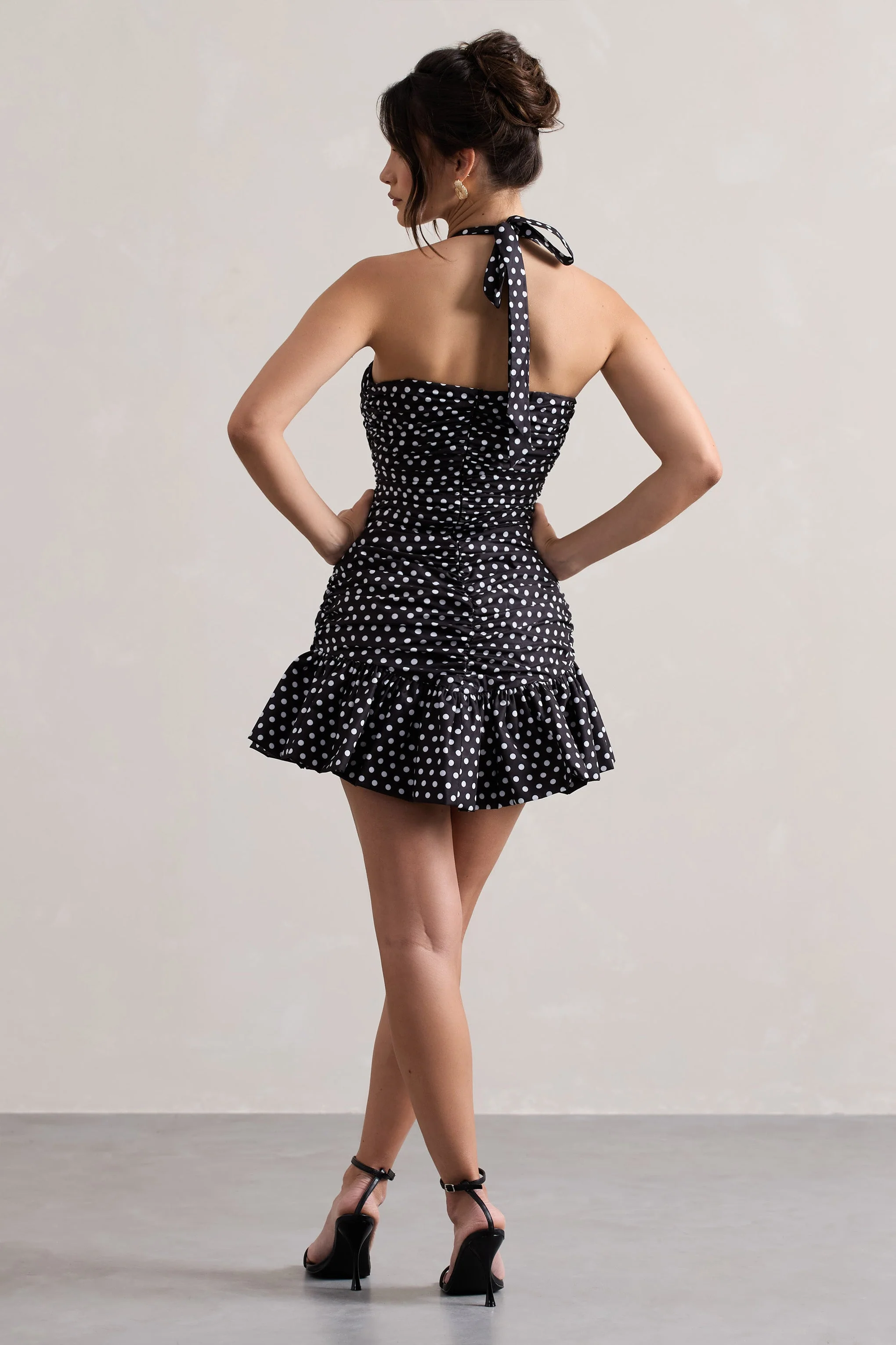 4434-zahra-black-white-polka-dot-halter-neck-ruched-mini-dress-with-ruffle-hem-1.webp