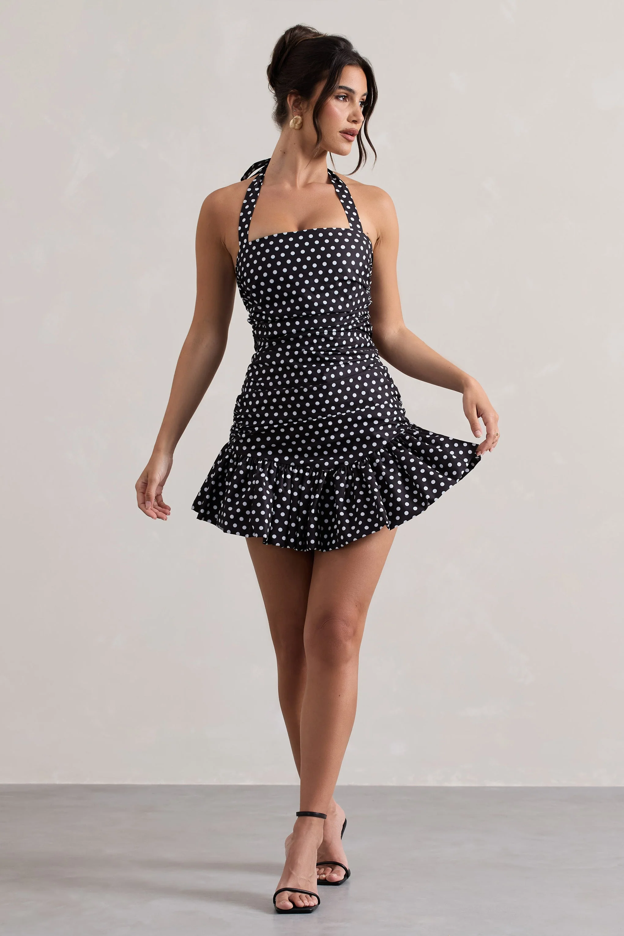 4434-zahra-black-white-polka-dot-halter-neck-ruched-mini-dress-with-ruffle-hem-1.webp