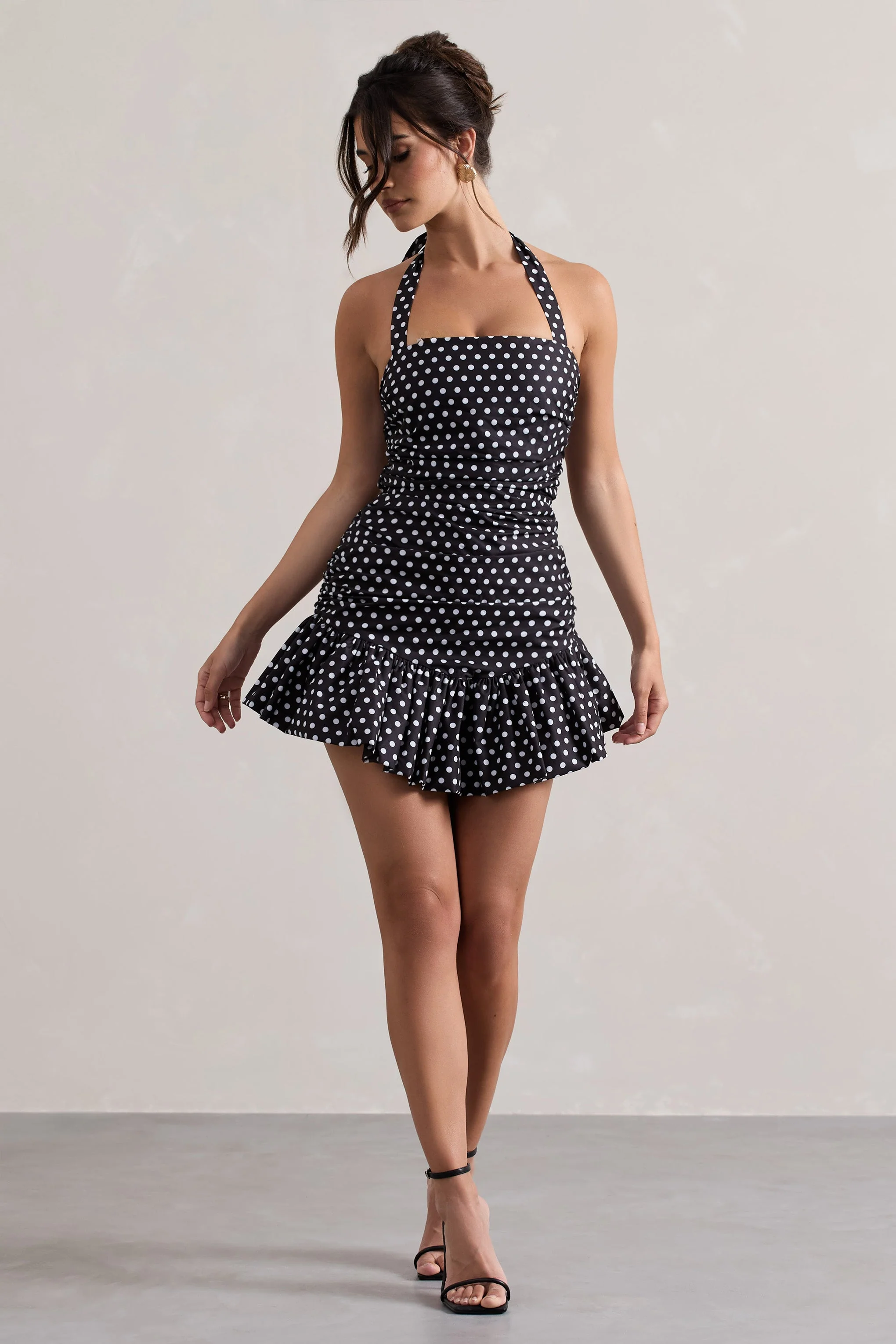 4434-zahra-black-white-polka-dot-halter-neck-ruched-mini-dress-with-ruffle-hem-1.webp