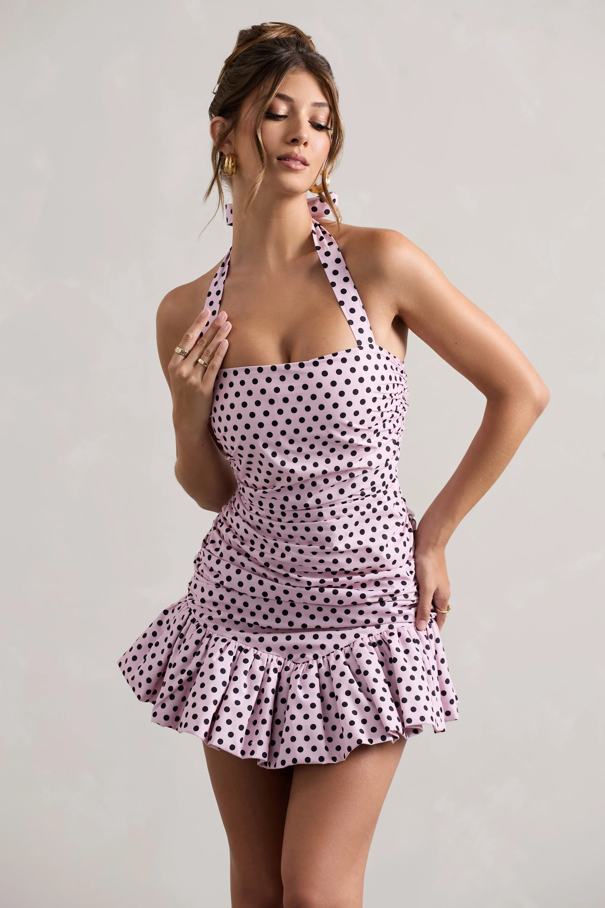 4441-zahra-pink-black-polka-dot-halter-neck-ruched-mini-dress-with-ruffle-hem-1.webp