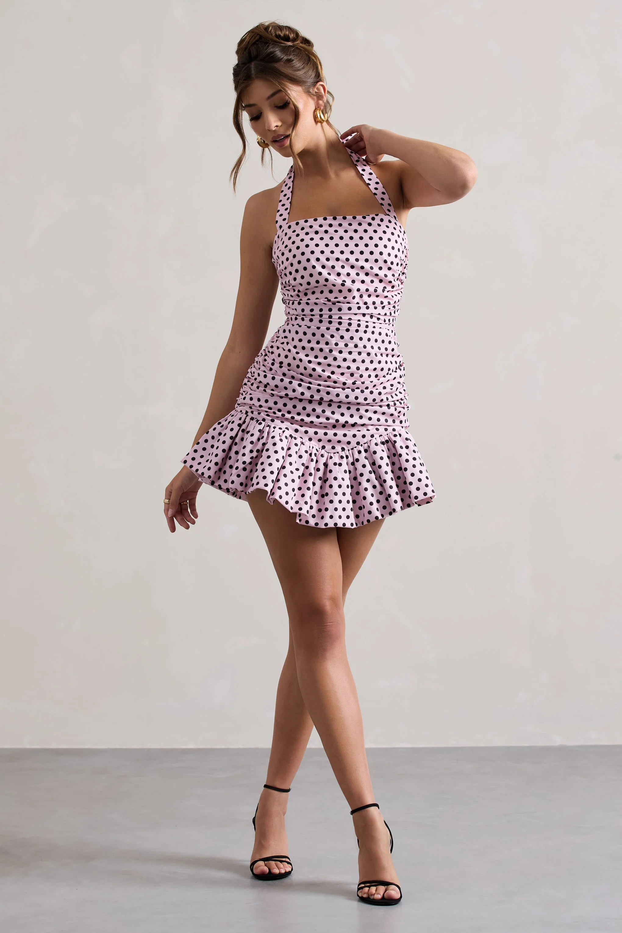 4441-zahra-pink-black-polka-dot-halter-neck-ruched-mini-dress-with-ruffle-hem-1.webp