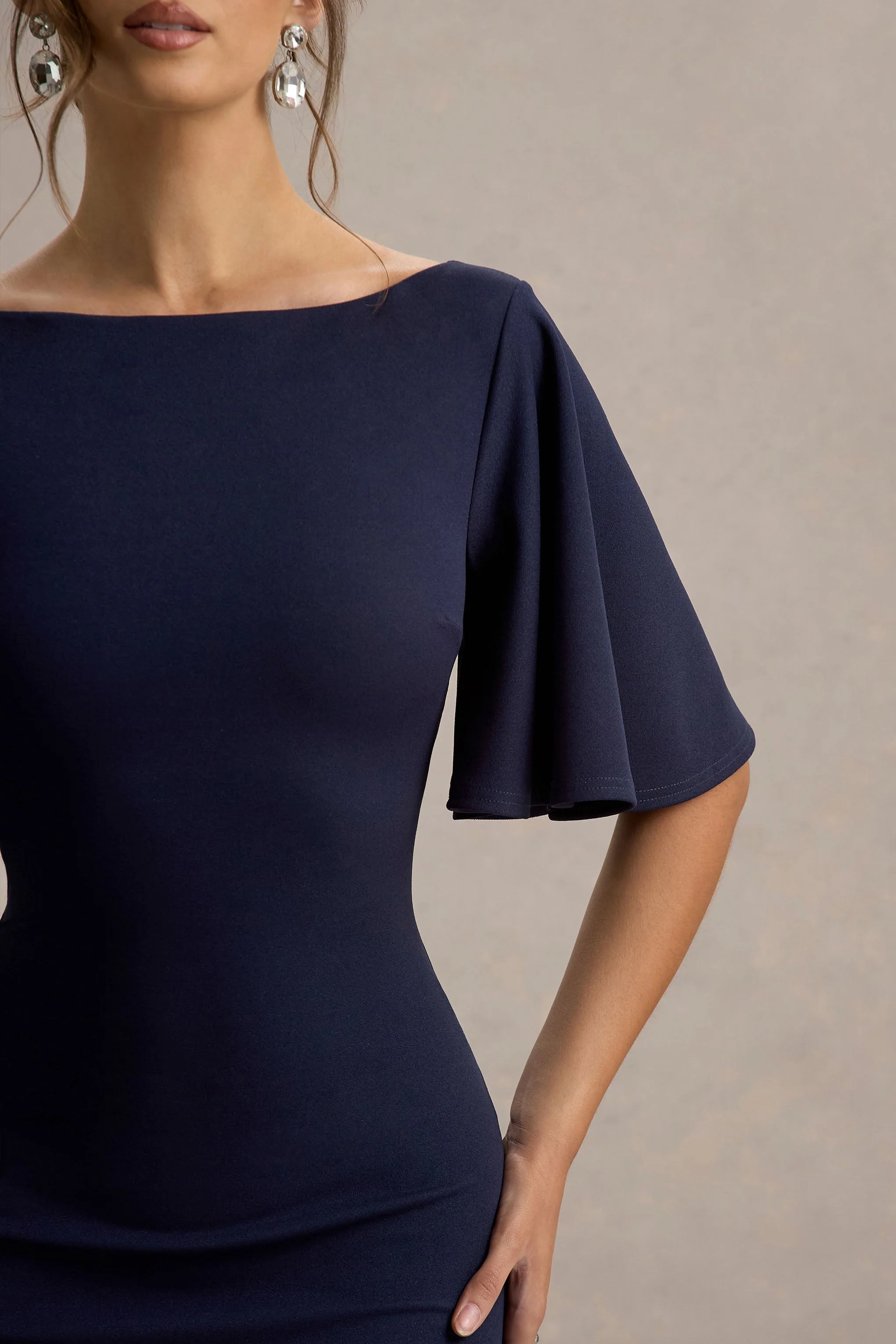 8962-ashling-navy-flutter-sleeve-hanky-hem-midi-dress-1.webp