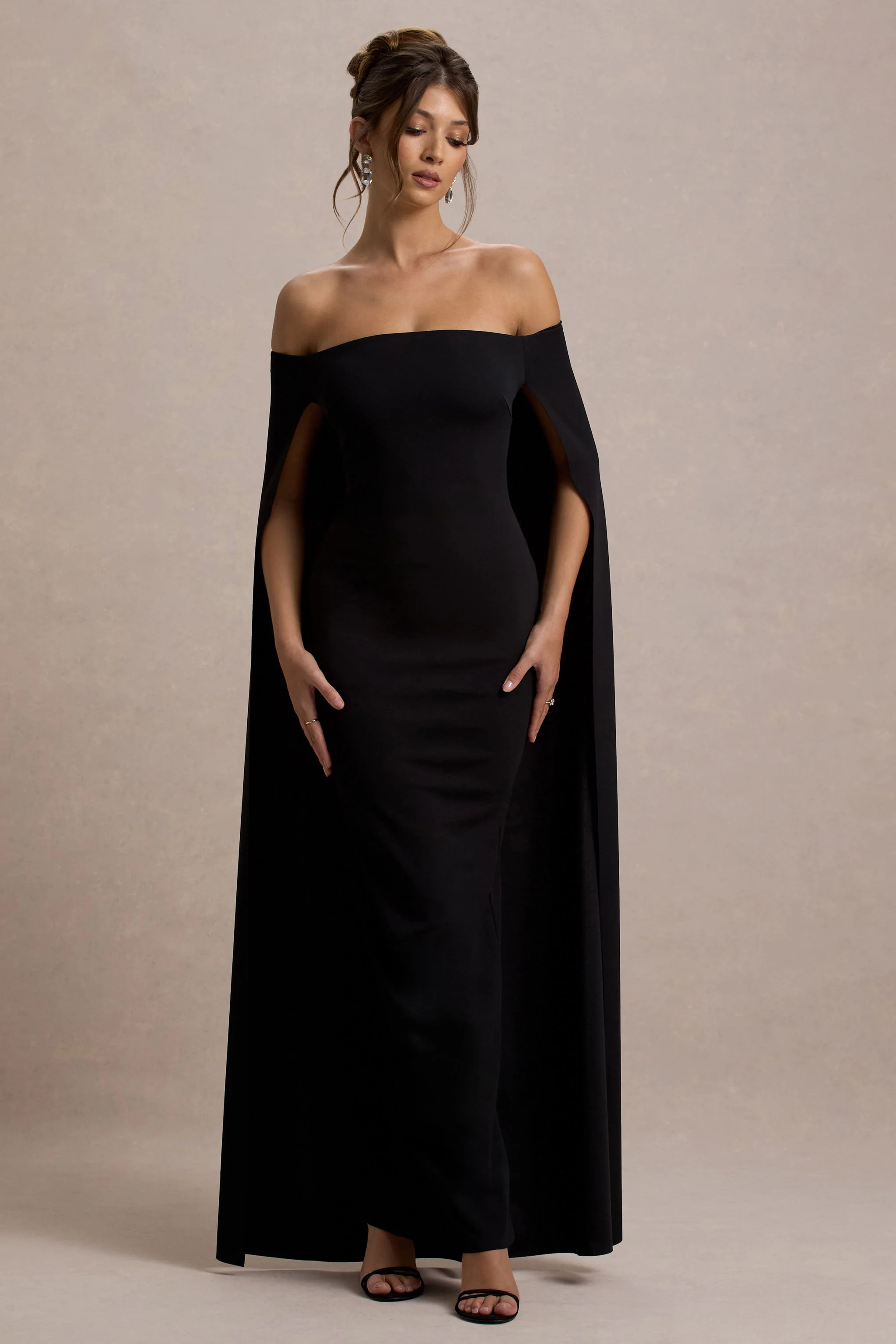 9081-genovia-black-bardot-cape-maxi-dress-1.webp